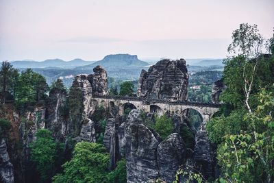 High angle view of old ruin and mountains against sky