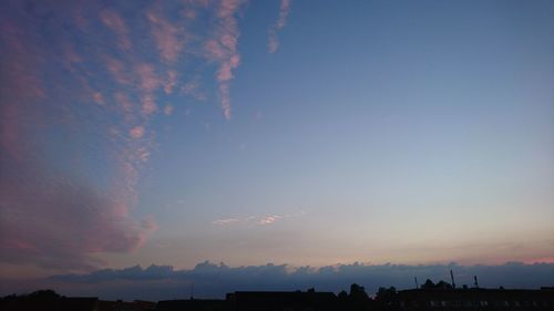 Silhouette landscape against sky during sunset