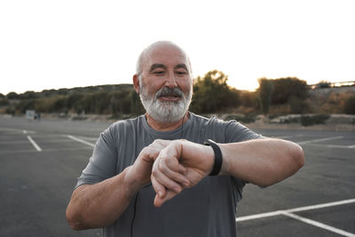 Portrait of man standing on road