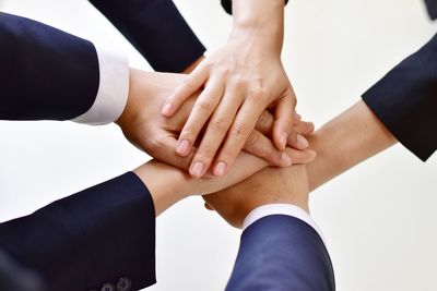 Midsection of couple holding hands