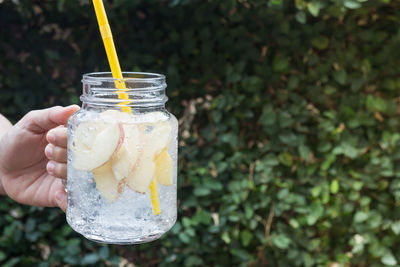 Cropped hand holding drink