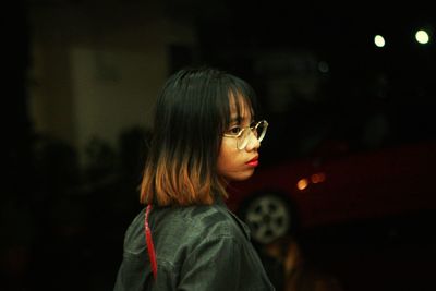 Portrait of young woman looking away