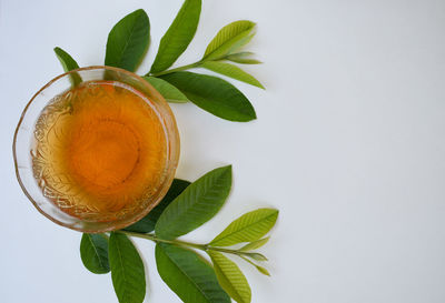 Close-up of tea cup and leaves