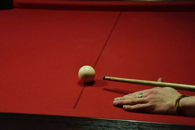 Person playing with ball on table
