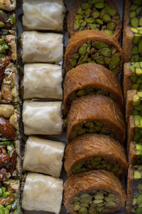 Arabic and turkish oriental sweets desserts made of pistachios and kunafa with leafy dough