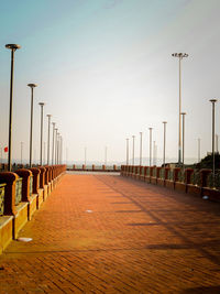 Pier over river against sky