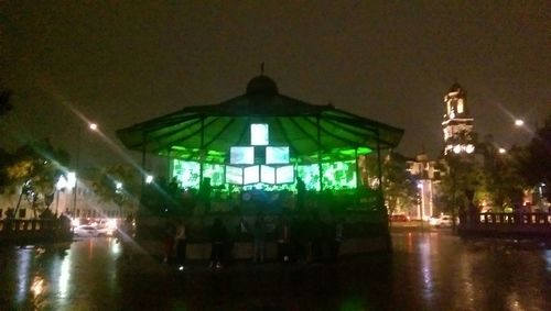 Illuminated fountain at night