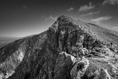 Rock formations on mountain against sky