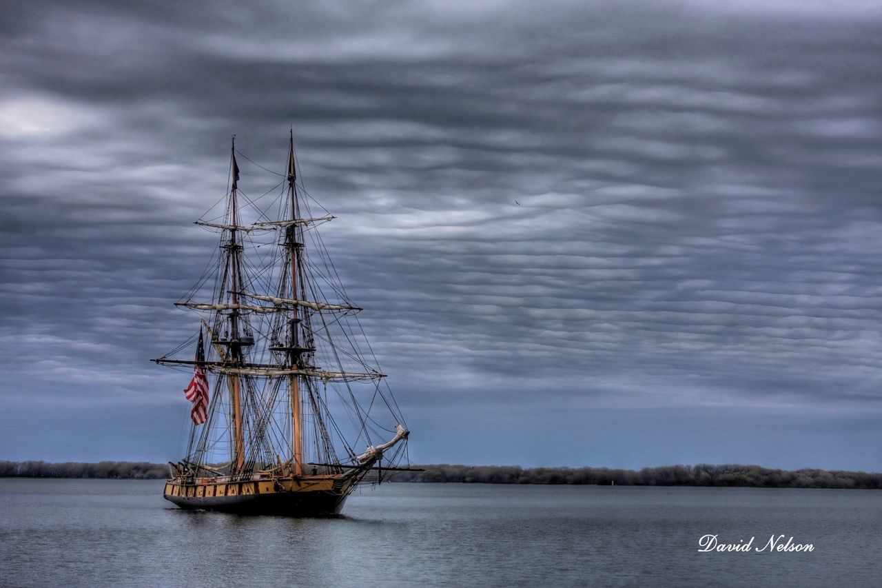 water, waterfront, nautical vessel, sky, transportation, boat, cloud - sky, mode of transport, sea, cloudy, tranquility, tranquil scene, cloud, nature, lake, moored, scenics, beauty in nature, rippled, outdoors