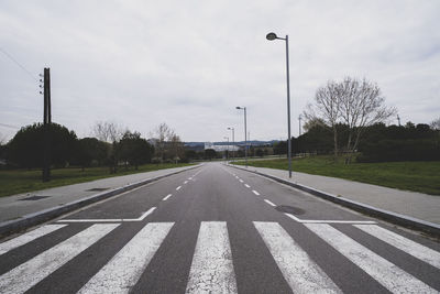 Empty road against sky