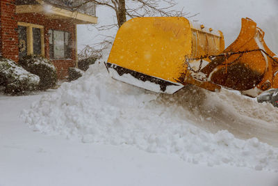 Snow covered buildings during winter