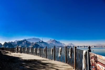 Scenic view of snowcapped mountains against clear blue sky