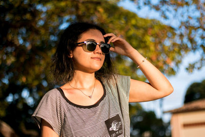 Portrait of young woman wearing sunglasses