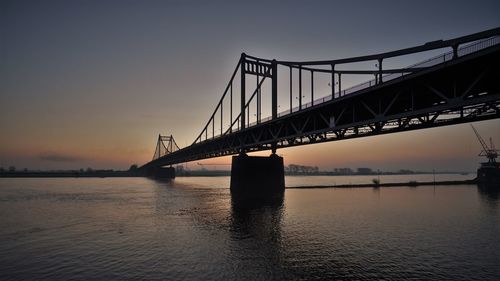 View of suspension bridge at sunset