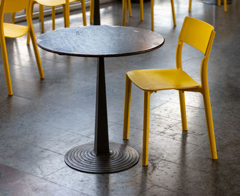 Yellow chairs at cafe in train station