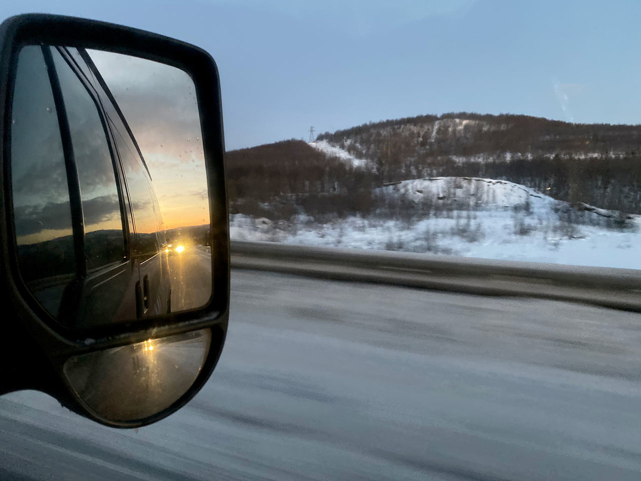 SCENIC VIEW OF MOUNTAINS AGAINST SKY SEEN THROUGH CAR WINDSHIELD