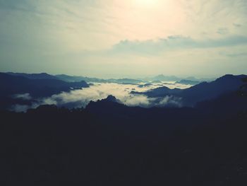 Scenic view of silhouette mountains against sky