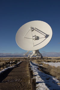 View of very large array  against clear blue sky