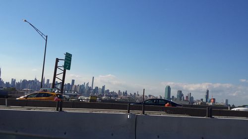 View of cityscape against blue sky