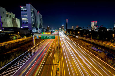 High angle view of light trails on road at night