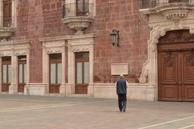 Woman standing in front of building