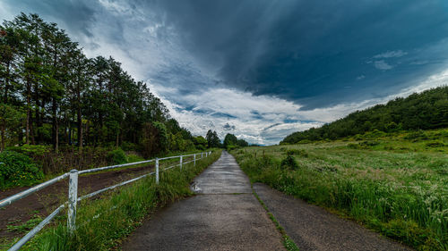 Road to the cloudy sky