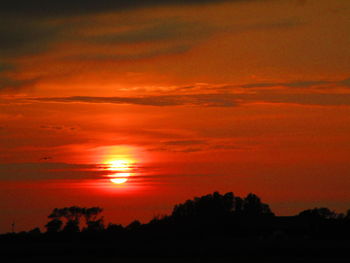 Scenic view of dramatic sky during sunset