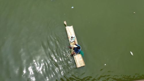 High angle view of man sailing in lake