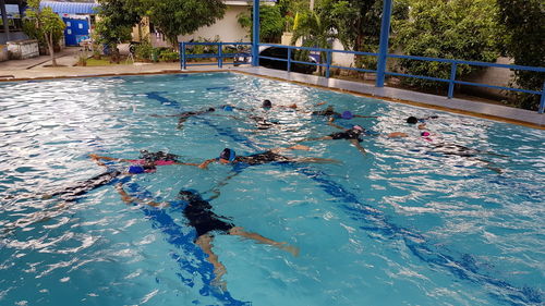 High angle view of people swimming in pool