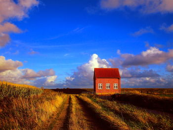 House on field against sky