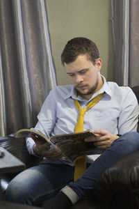 Young man sitting at home