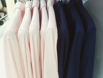 Close-up of clothes hanging in store