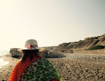 Woman standing against clear sky