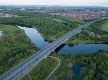 High angle view of road by river against sky