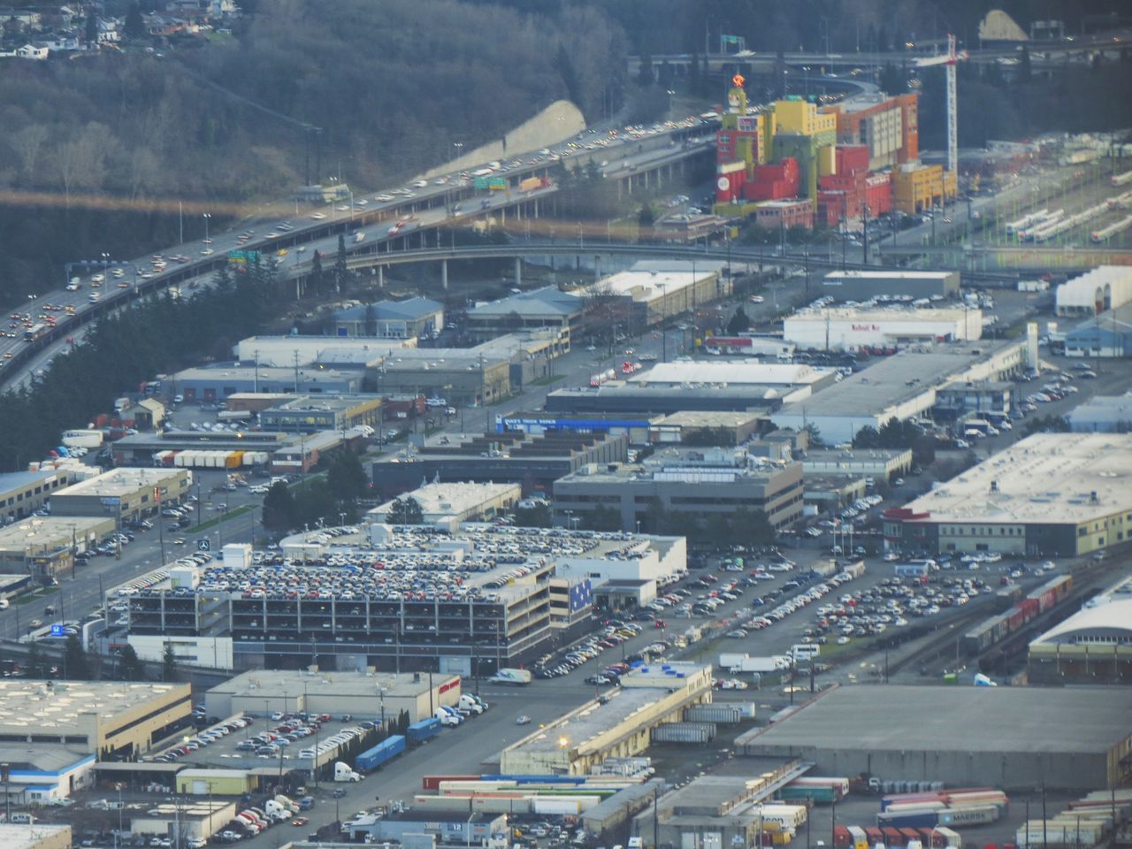 transportation, high angle view, architecture, built structure, city, building exterior, mode of transport, car, cityscape, land vehicle, road, city life, street, bridge - man made structure, crowded, aerial view, traffic, outdoors, connection, residential district