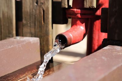 Close-up of water drop on pipe