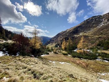 Scenic view of landscape and mountains against sky