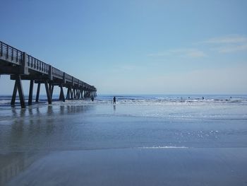 Pier over sea against sky