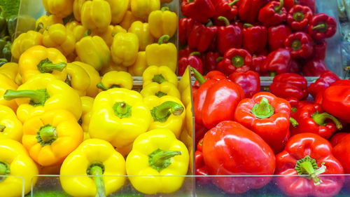Red bell peppers for sale in market stall