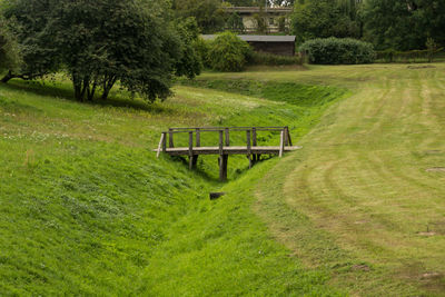 Small wooden bridge over a drainage ditch