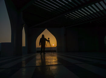 Silhouette man in corridor