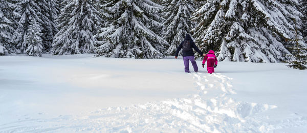 Woman on snow covered land