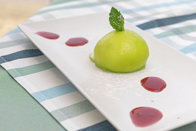 High angle view of fruits in plate on table