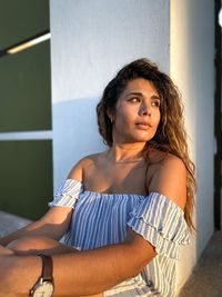 Portrait of young woman looking away
