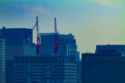 Modern buildings in city against sky