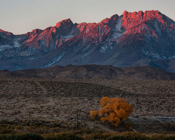 Scenic view of rocky mountain range at sunset