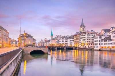 Cityscape of downtown zurich in switzerland during dramatic sunset.