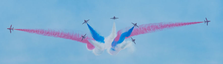 Low angle view of vapor trails in sky