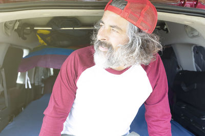 Portrait of young man in car