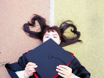 Funny young woman at graduation